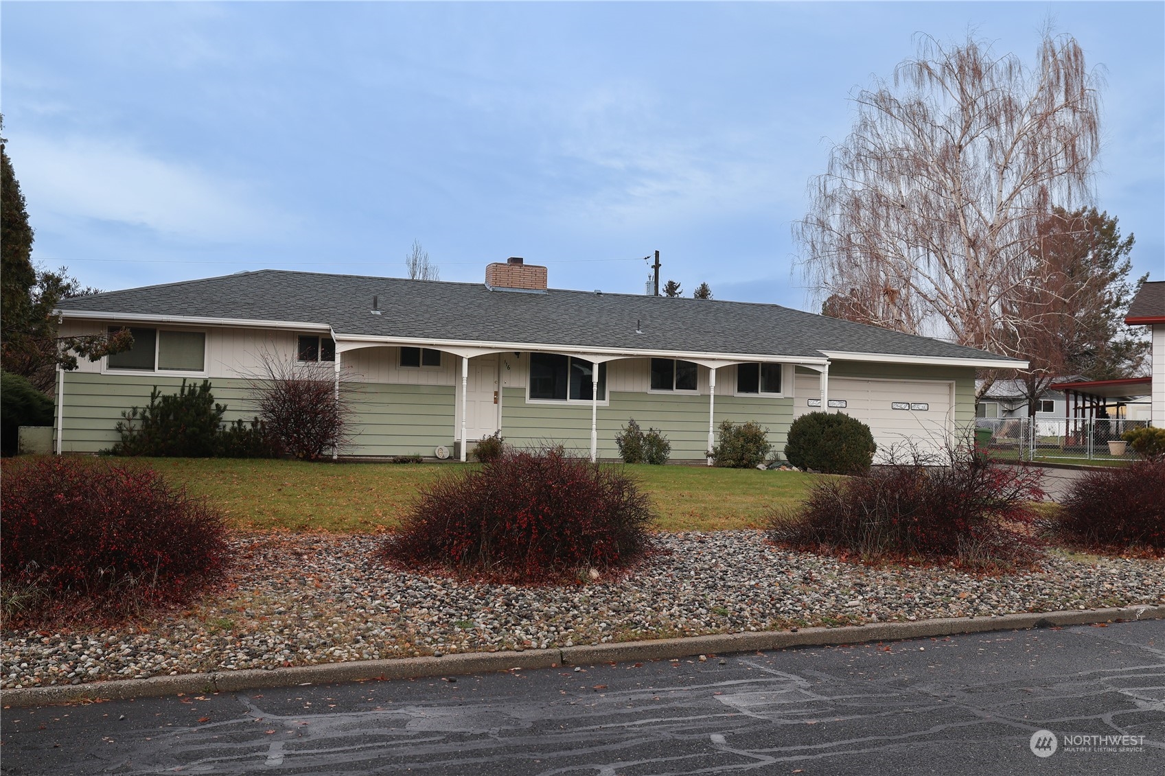116 Silver Drive Electric City, WA 99123 - Photo 25 of 27 a front view of house with yard and trees in the background