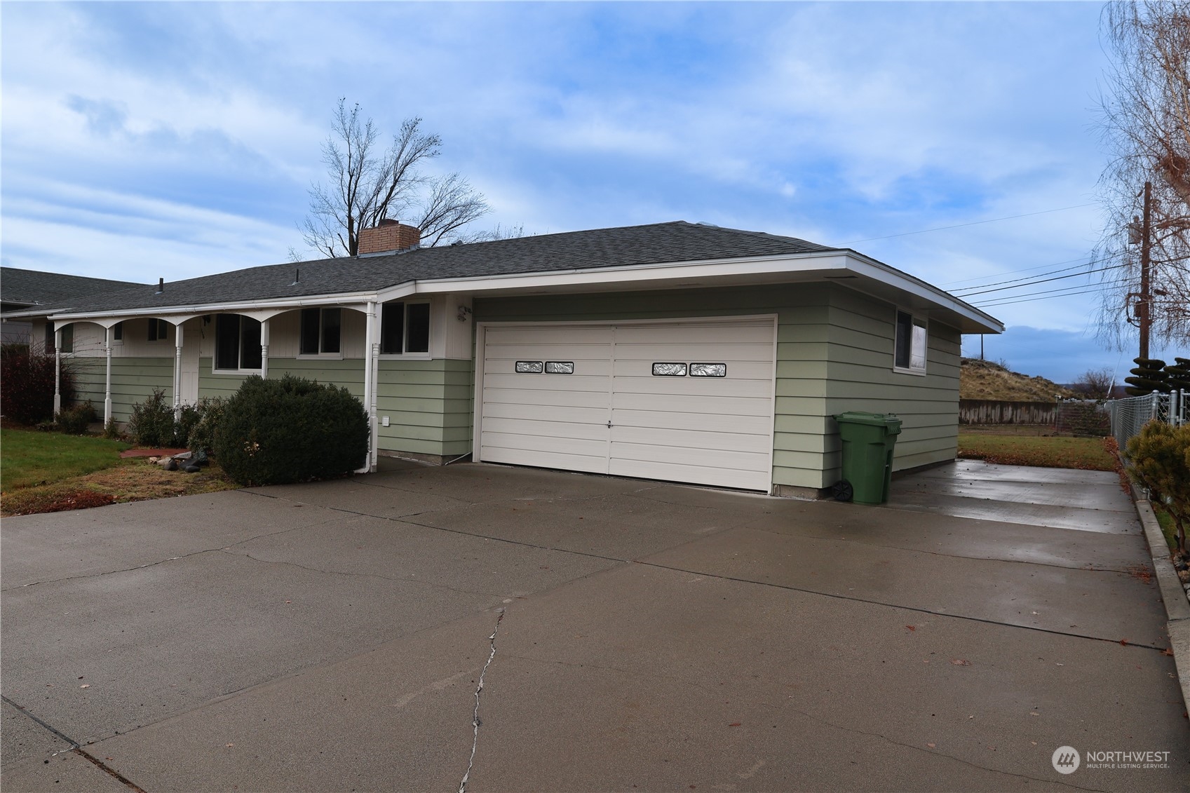 116 Silver Drive Electric City, WA 99123 - Photo 26 of 27 a front view of a house with a yard and garage