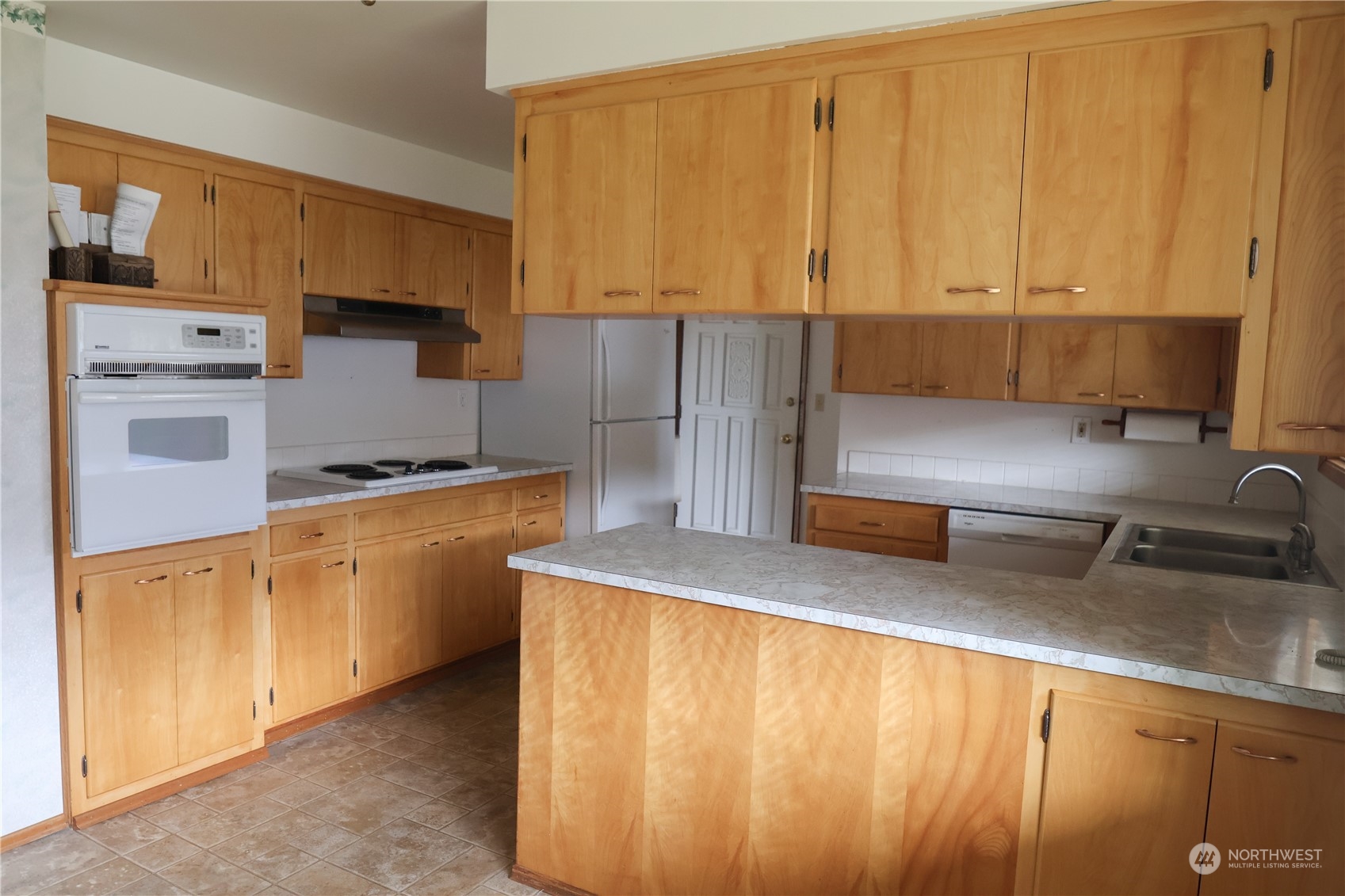 116 Silver Drive Electric City, WA 99123 - Photo 9 of 27 a kitchen with a sink a stove and cabinets