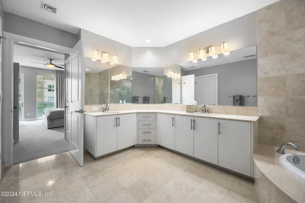 a view of a room with wooden floor and bathroom