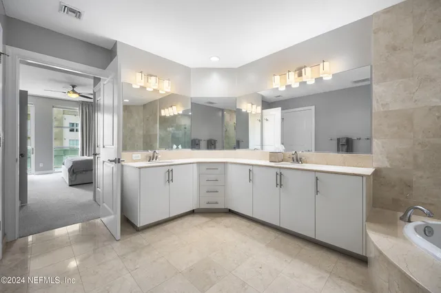 a view of a room with wooden floor and bathroom