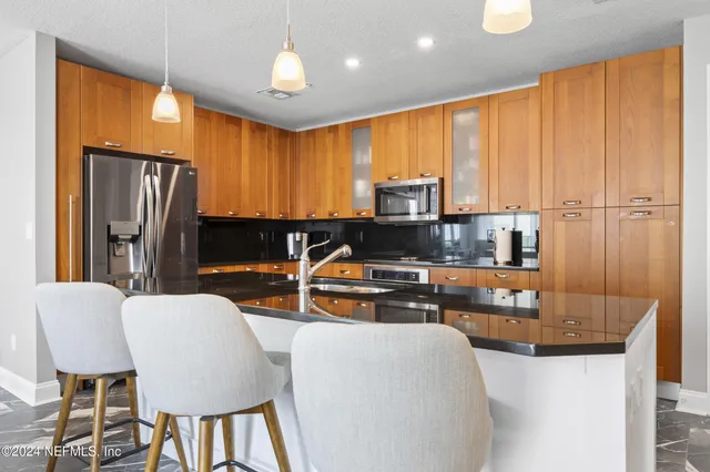 a front view of a building with a yard