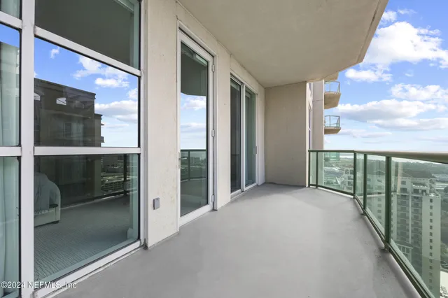 a view of a swimming pool with a terrace