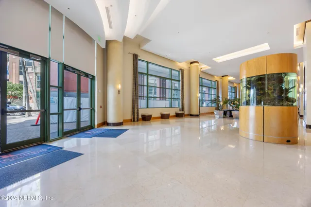 a kitchen with stainless steel appliances granite countertop wooden cabinets a stove top oven a sink and dishwasher