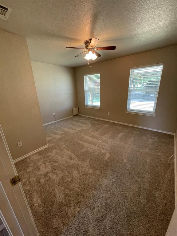 111 Quail Drive Springtown, TX 76082 - Photo 11 of 22 a view of an empty room with a window