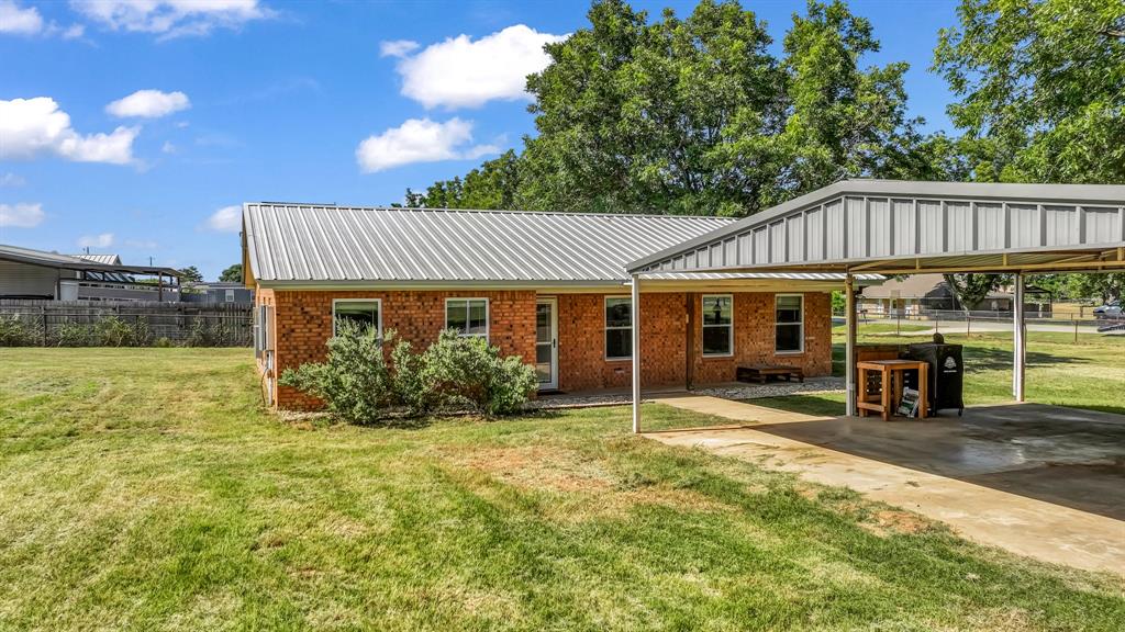 111 Quail Drive Springtown, TX 76082 - Photo 14 of 22 a view of a house with garden and porch