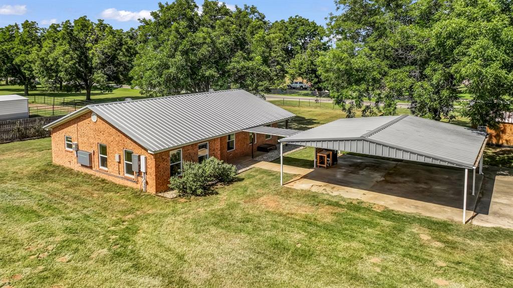 111 Quail Drive Springtown, TX 76082 - Photo 14 of 22 an aerial view of a house with swimming pool and large trees