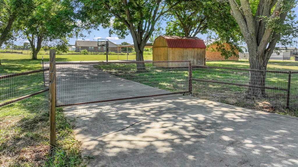 111 Quail Drive Springtown, TX 76082 - Photo 15 of 22 a view of a house with backyard and a tree