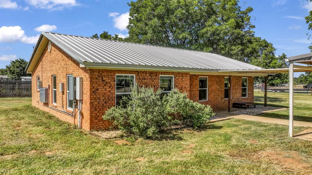 111 Quail Drive Springtown, TX 76082 - Photo 18 of 22 a view of house with yard and sitting area