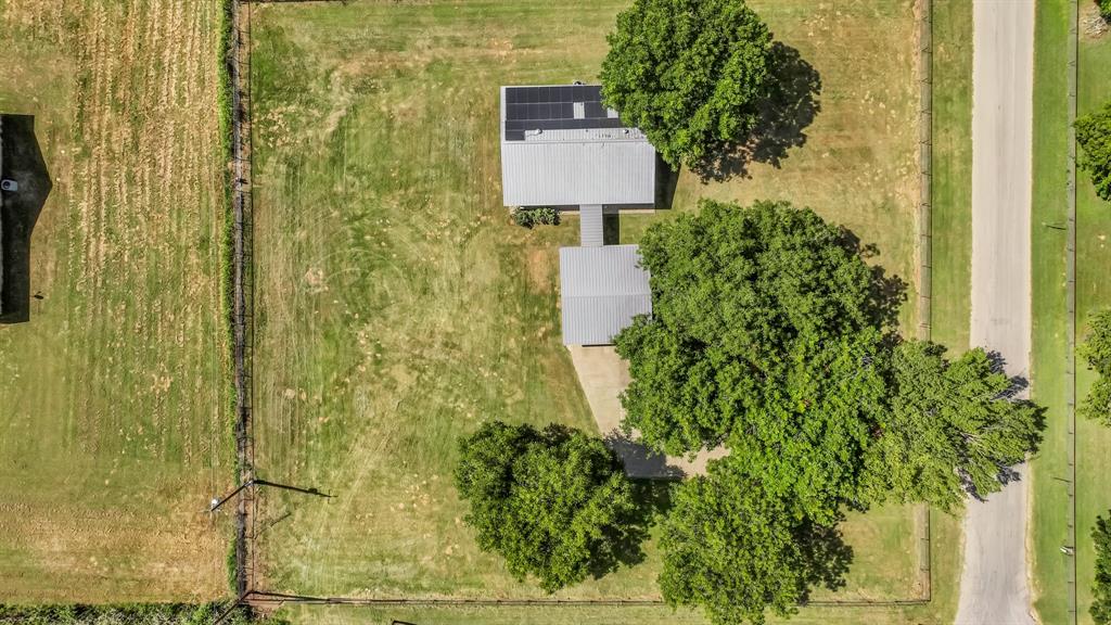 111 Quail Drive Springtown, TX 76082 - Photo 21 of 22 a view of a bathroom with a sink and mirror