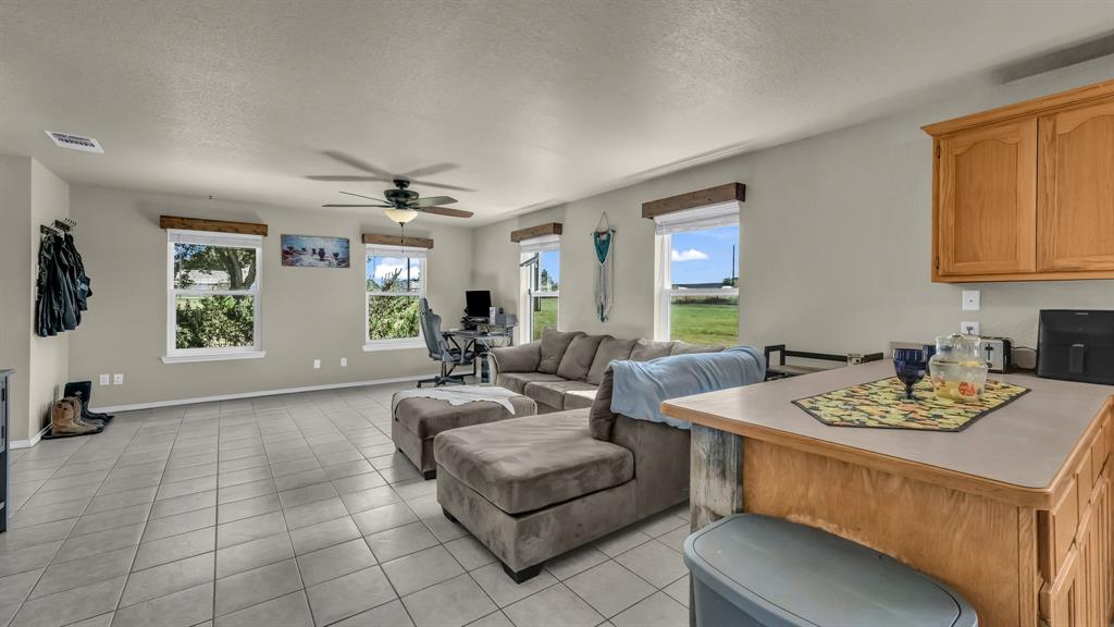 111 Quail Drive Springtown, TX 76082 - Photo 4 of 22 a living room with furniture and a window