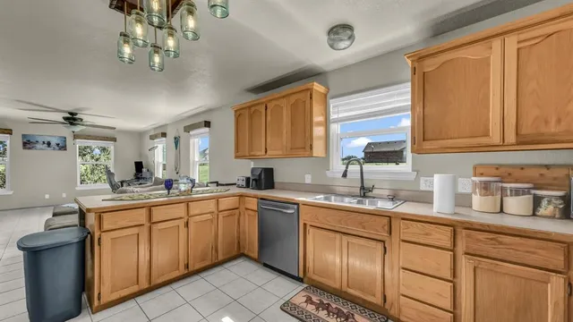 a view of a bathroom with a sink and mirror