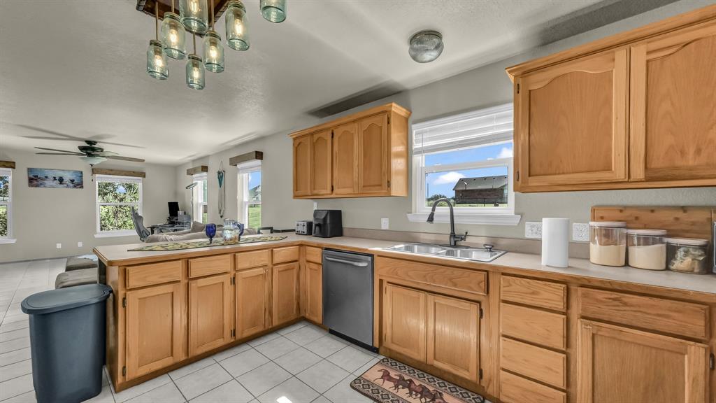 111 Quail Drive Springtown, TX 76082 - Photo 22 of 22 a kitchen with a sink cabinets and window