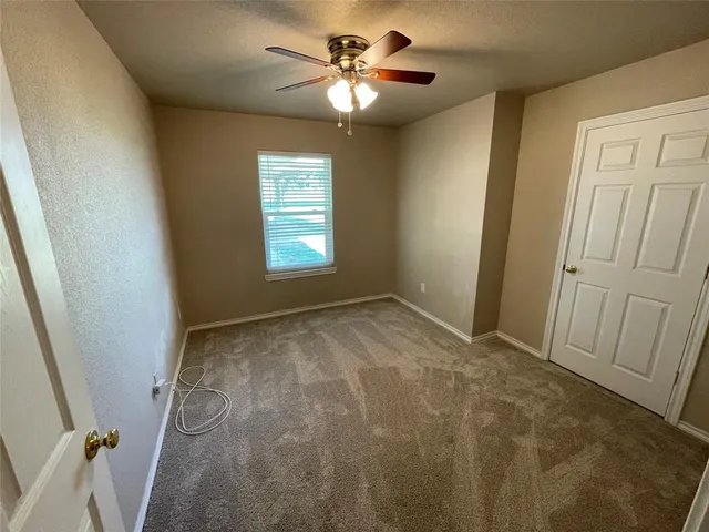 a bathroom with a sink vanity mirror and toilet