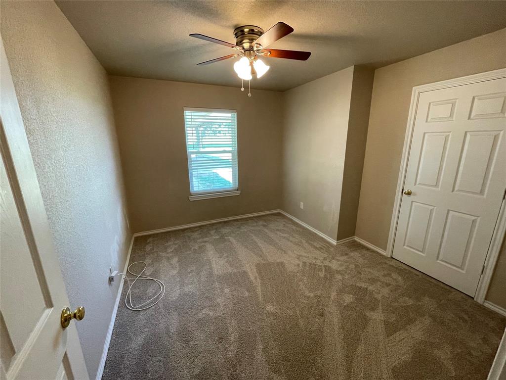 111 Quail Drive Springtown, TX 76082 - Photo 9 of 22 a view of an empty room and a window