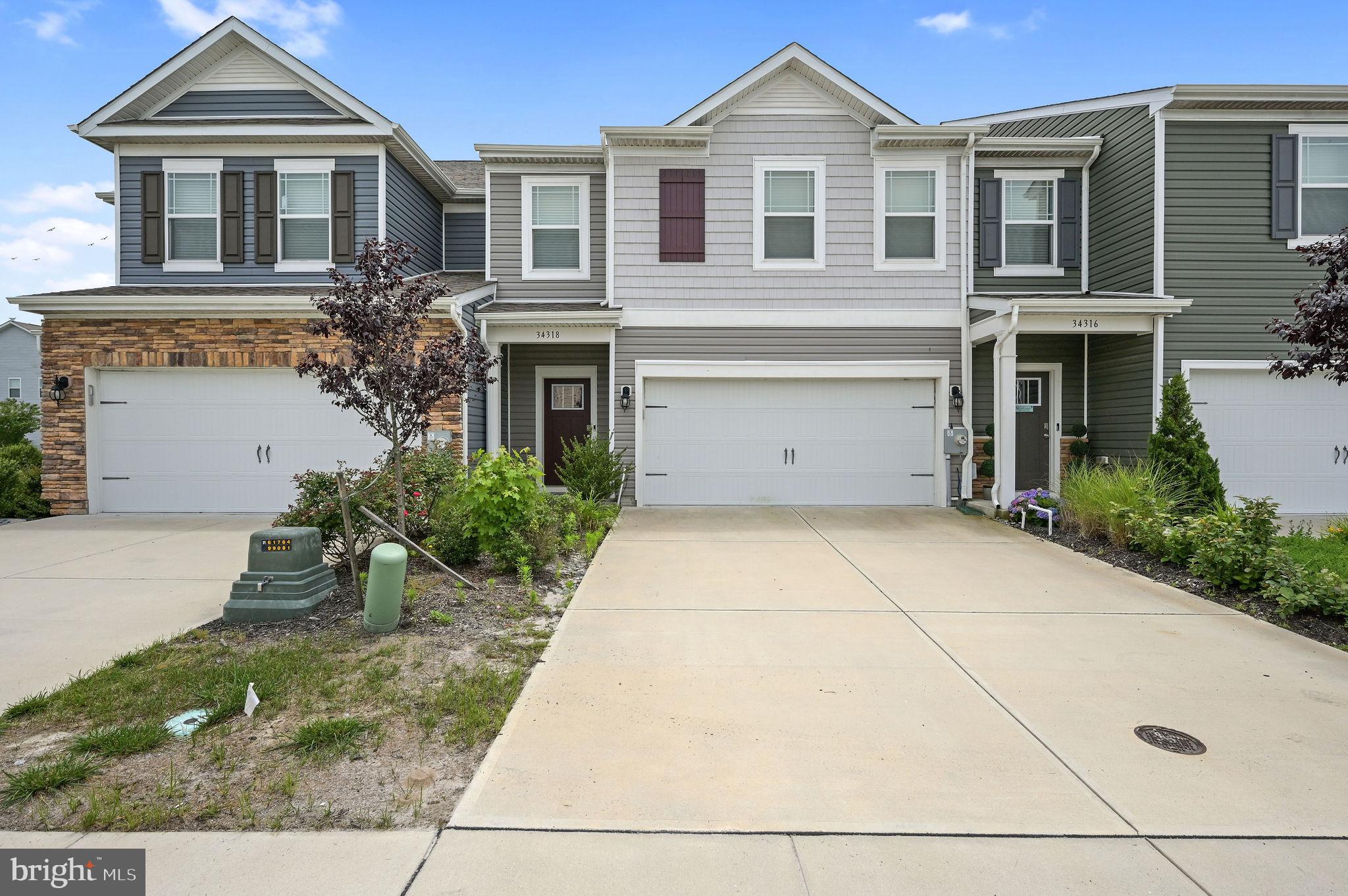 34318 Gooseberry Avenue Ocean View, DE 19970 - Photo 1 of 32 a front view of a house with garden