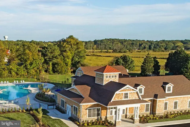 an aerial view of multiple houses with yard