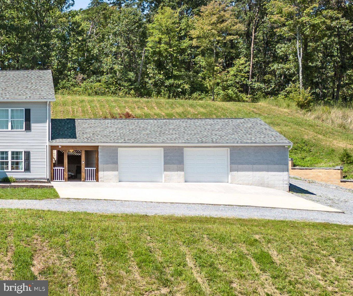 210 Gough Road Winchester, VA 22602 - Photo 31 of 58 38' x 28' Heated 3 Car Garage w/ Storage