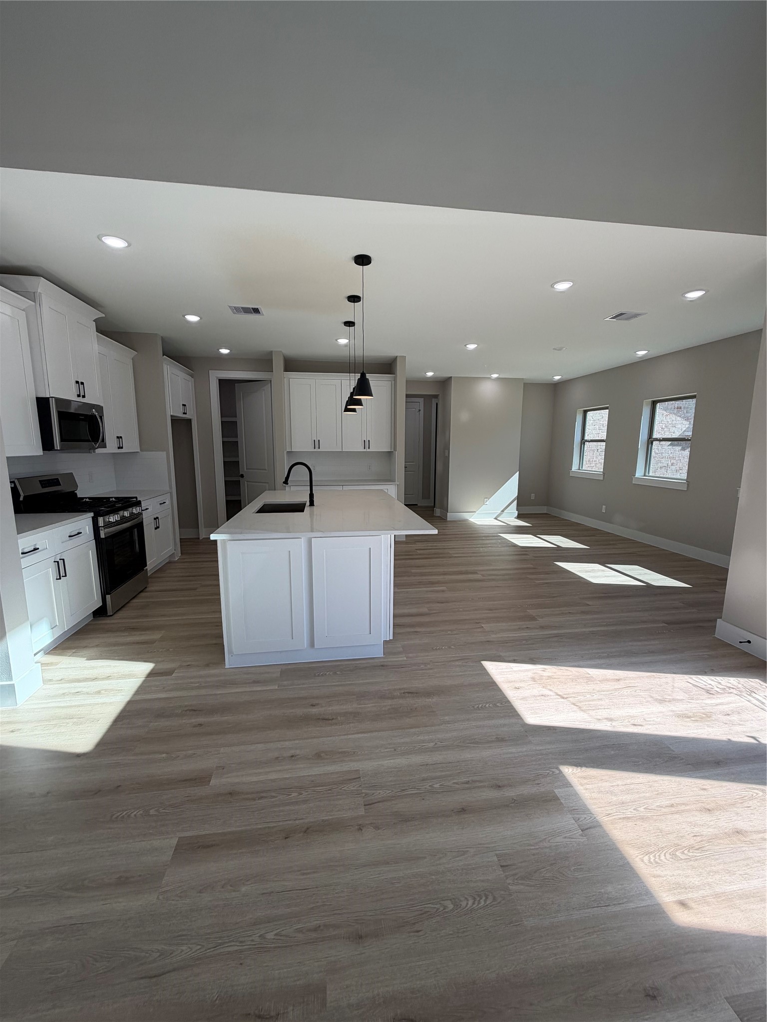 2523 Liguria Spring Spring, TX 77388 - Photo 5 of 26 a large white kitchen with a large window