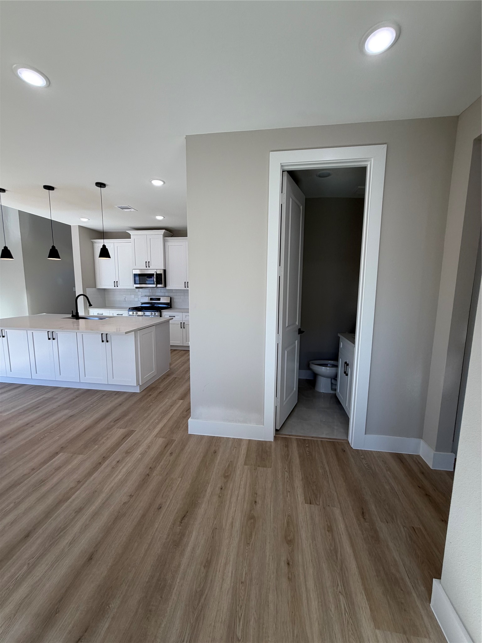 2523 Liguria Spring Spring, TX 77388 - Photo 7 of 26 a view of a kitchen with wooden floor