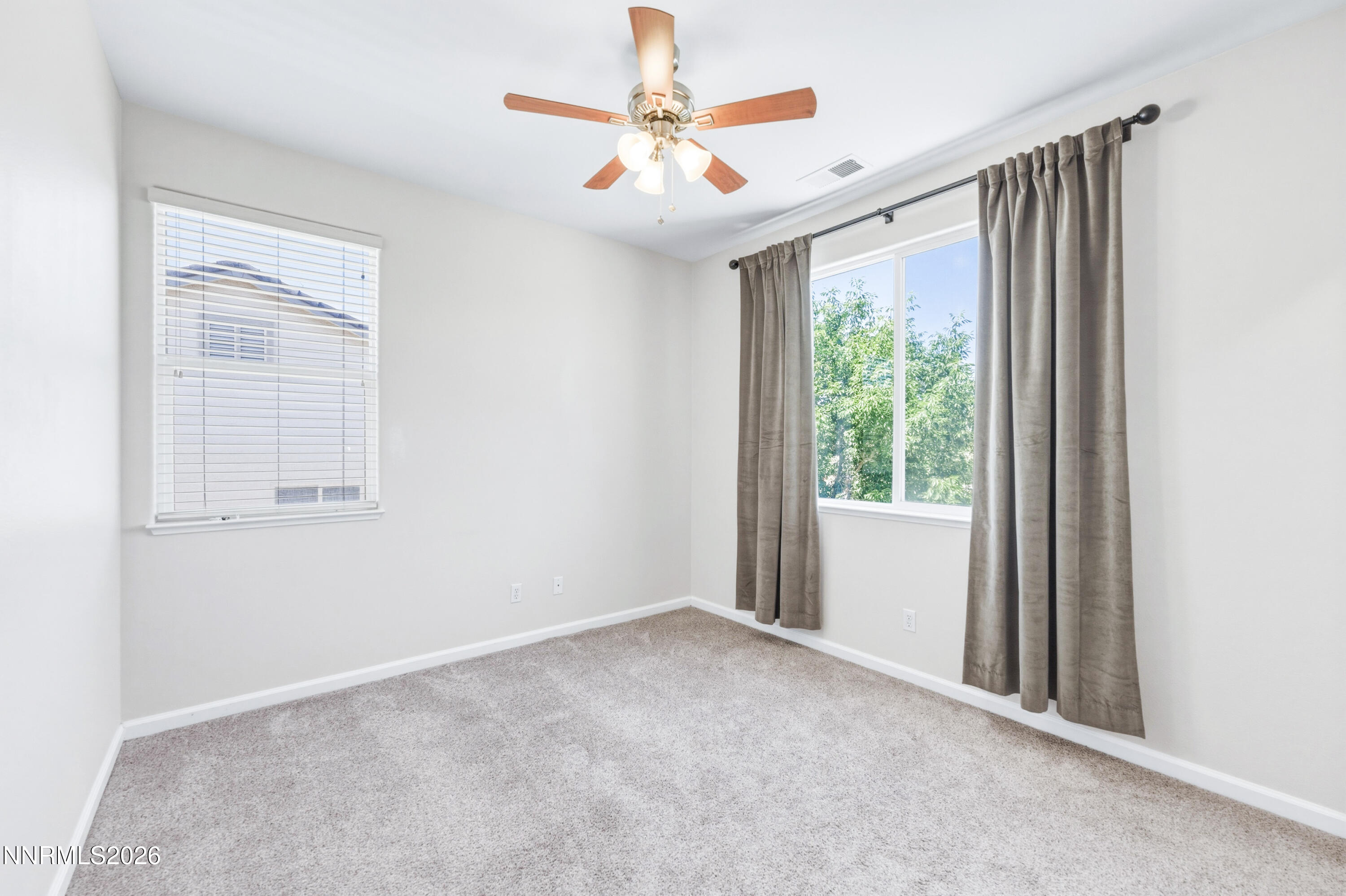 1770 Kodiak Circle Reno, NV 89511 - Photo 22 of 32 an empty room with windows and fan
