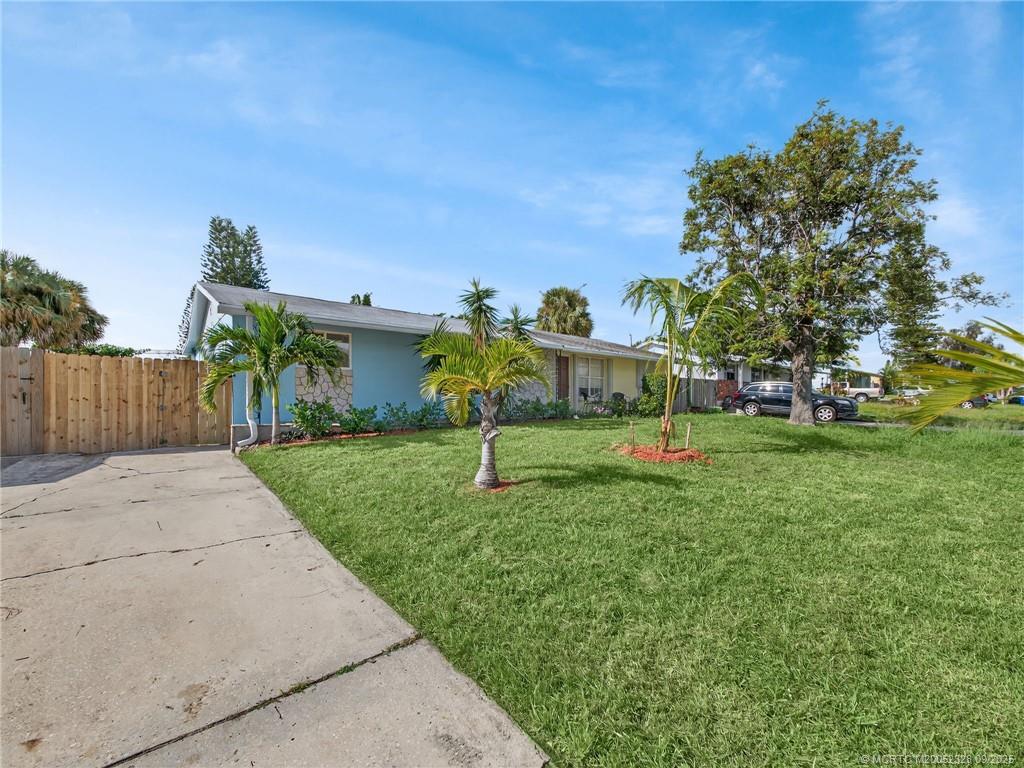 2346 Northeast Rustic Place Jensen Beach, FL 34957 - Photo 3 of 18 a garden view