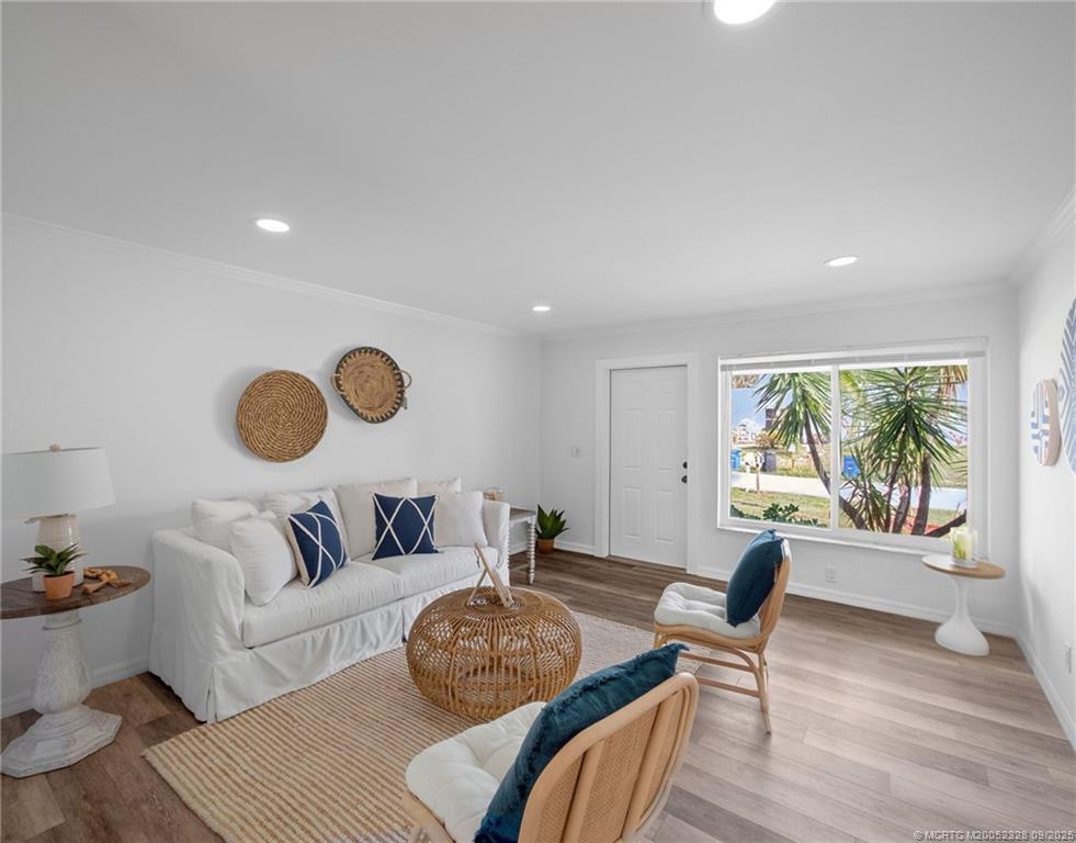 2346 Northeast Rustic Place Jensen Beach, FL 34957 - Photo 5 of 18 a living room with furniture and a window