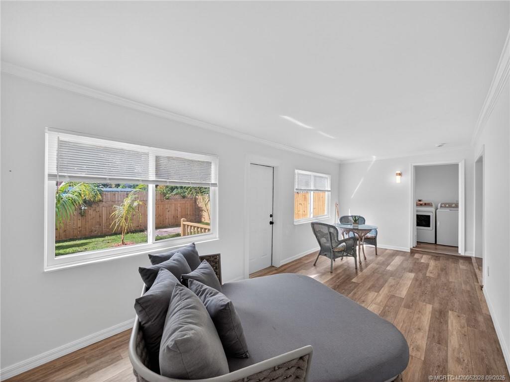 2346 Northeast Rustic Place Jensen Beach, FL 34957 - Photo 10 of 18 a living room with furniture and a large window