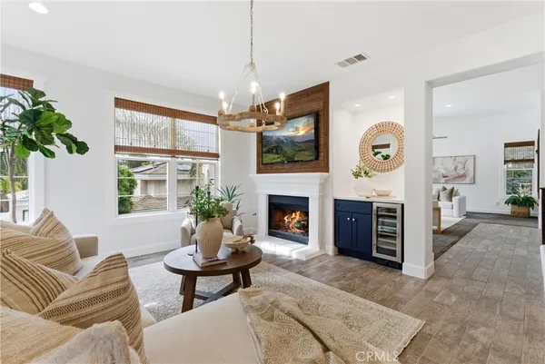 a kitchen with kitchen island granite countertop a sink stove and wooden cabinets