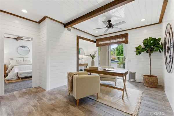 a bedroom with a bed and ceiling fan