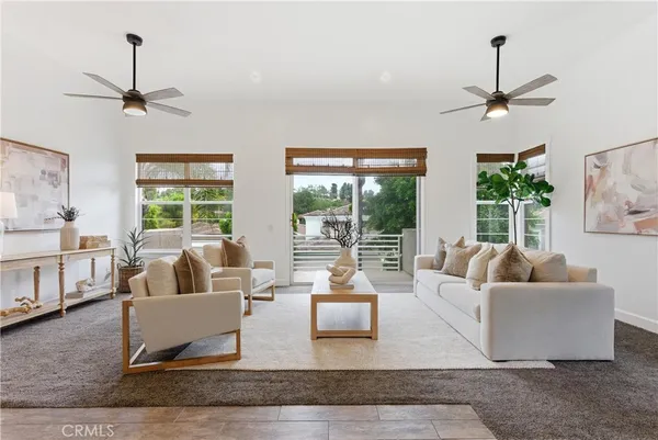 a living room with furniture or couch and a window