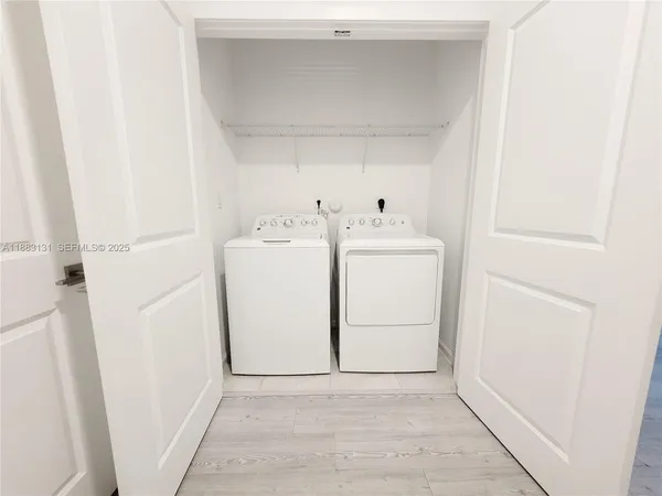 a utility room with dryer and washer