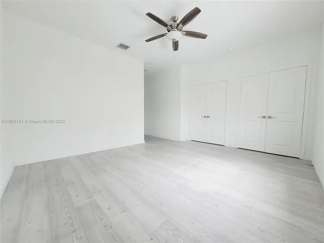 an empty room with entrance door