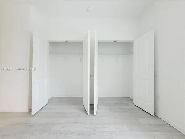 an empty room with entrance door