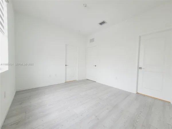 an empty room with an entryway
