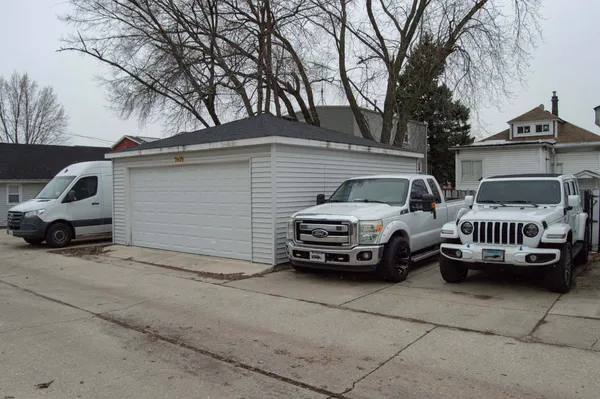 a view of a car parked in back of a house