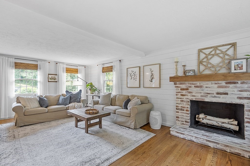27 Tanglewood Road Sterling, MA 01564 - Photo 14 of 38 a living room with furniture a window and a fireplace