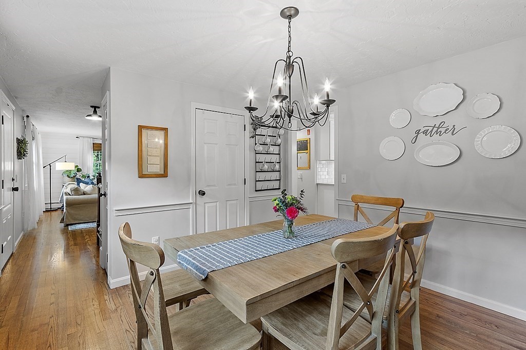 27 Tanglewood Road Sterling, MA 01564 - Photo 20 of 38 a view of a dining room with furniture wooden floor and chandelier