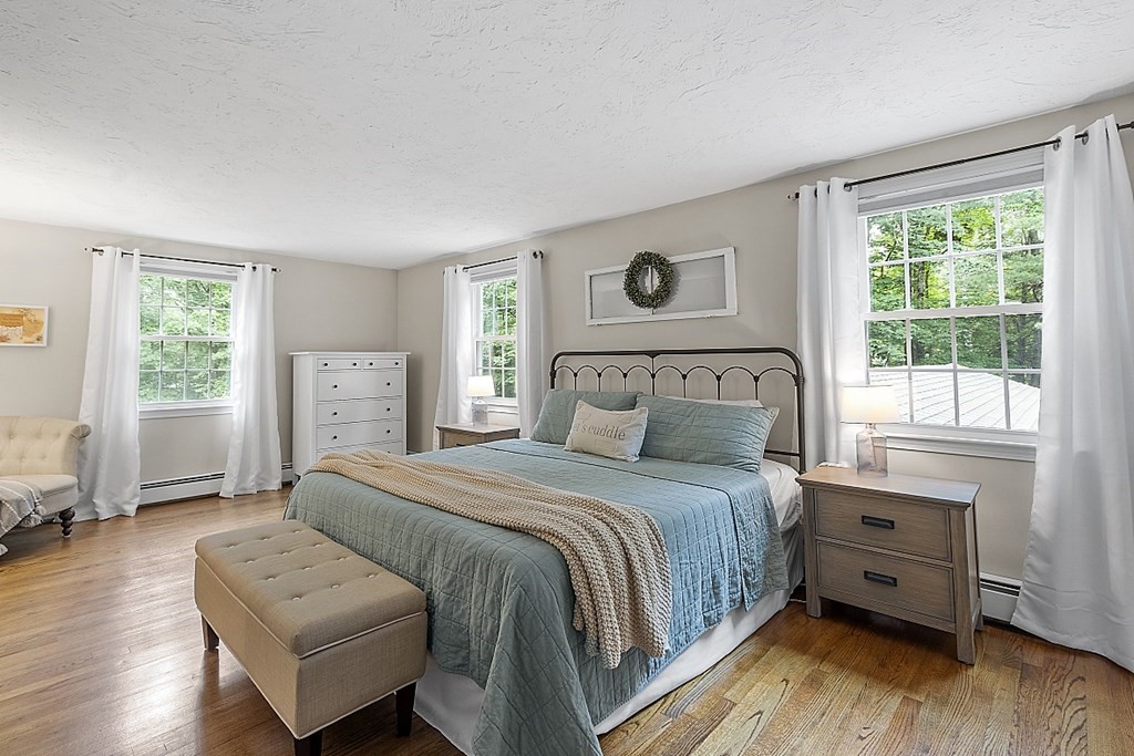 27 Tanglewood Road Sterling, MA 01564 - Photo 22 of 38 a bedroom with a bed and a couch