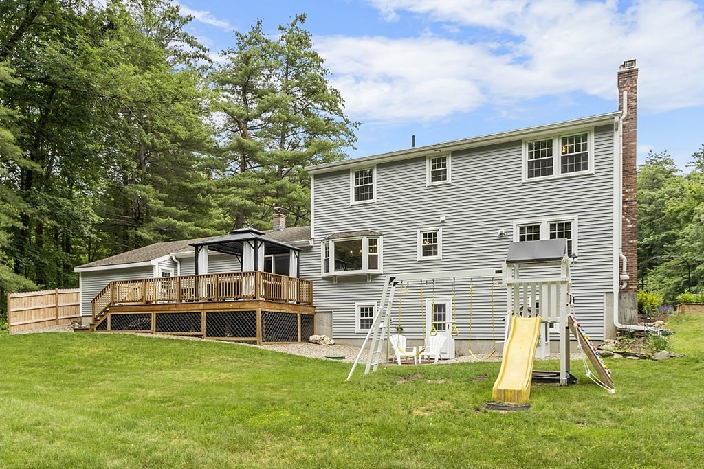 27 Tanglewood Road Sterling, MA 01564 - Photo 38 of 38 a front view of a house with a yard table and chairs