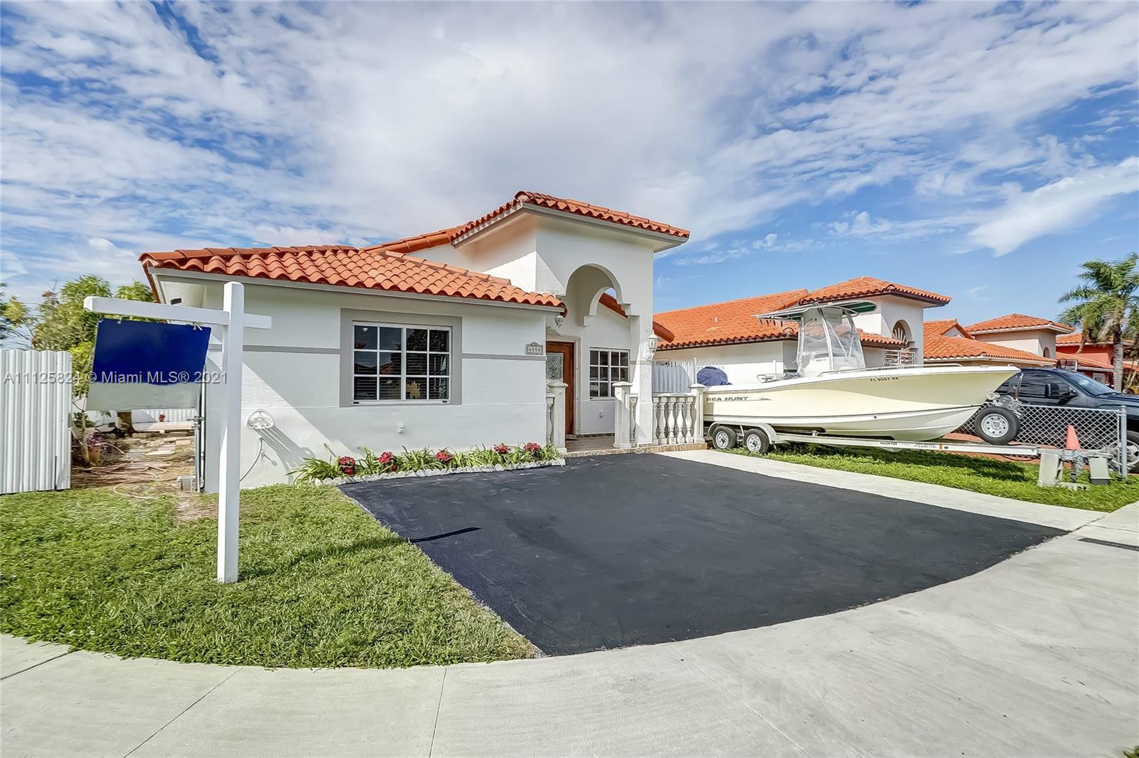6858 West 30th Lane Hialeah, FL 33018 - Photo 2 of 37 a view of a house with a swimming pool