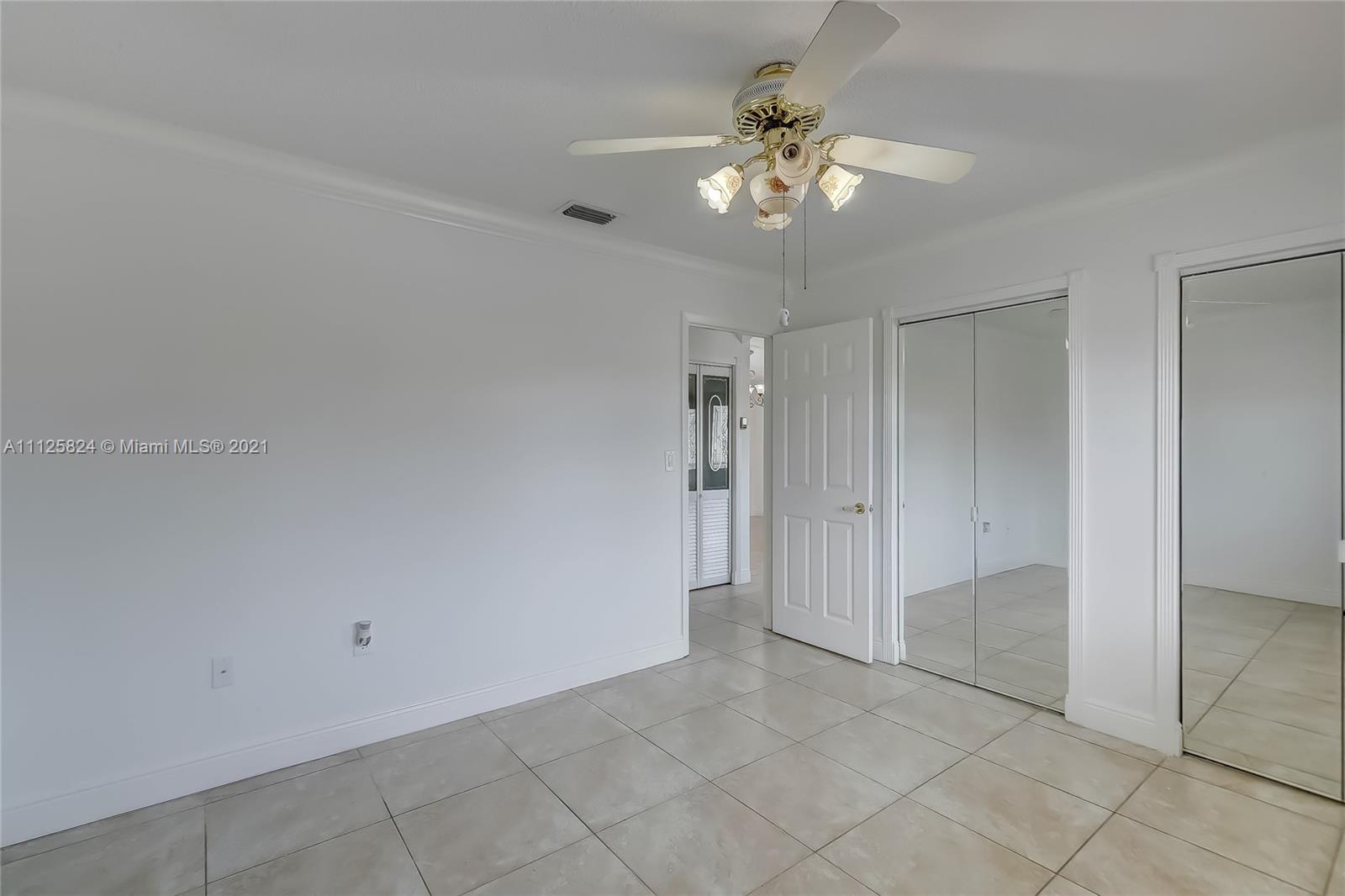 6858 West 30th Lane Hialeah, FL 33018 - Photo 11 of 37 wooden floor in an empty room