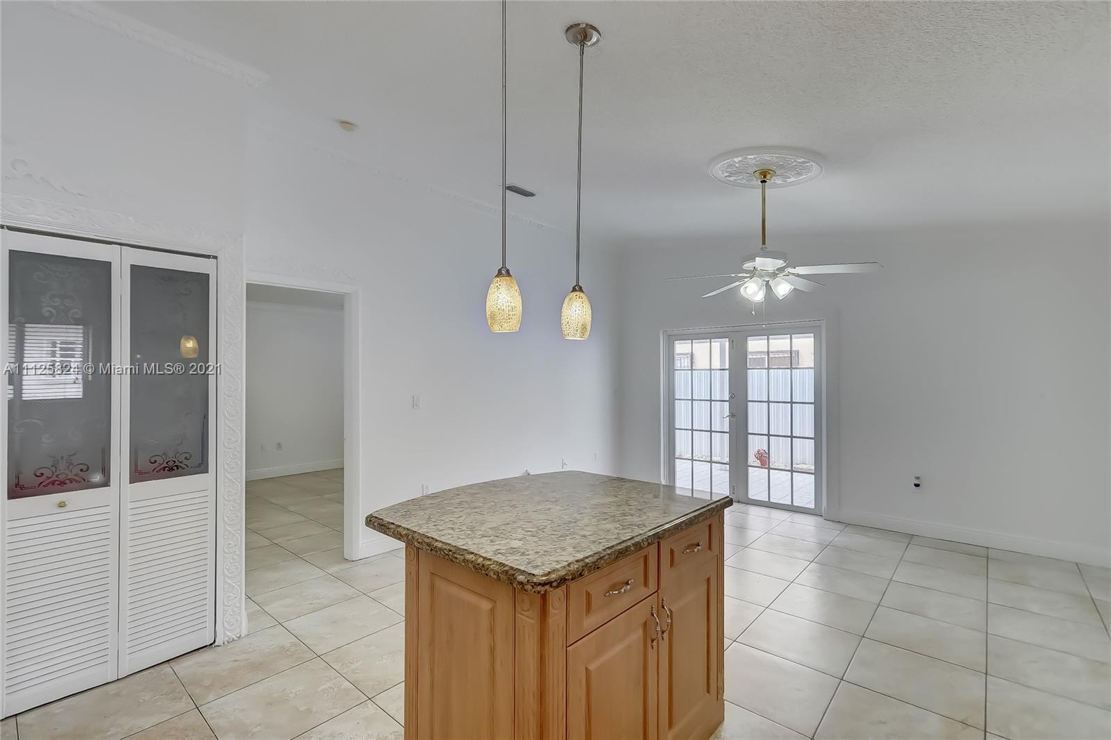 6858 West 30th Lane Hialeah, FL 33018 - Photo 18 of 37 a kitchen with a counter space cabinets and appliances