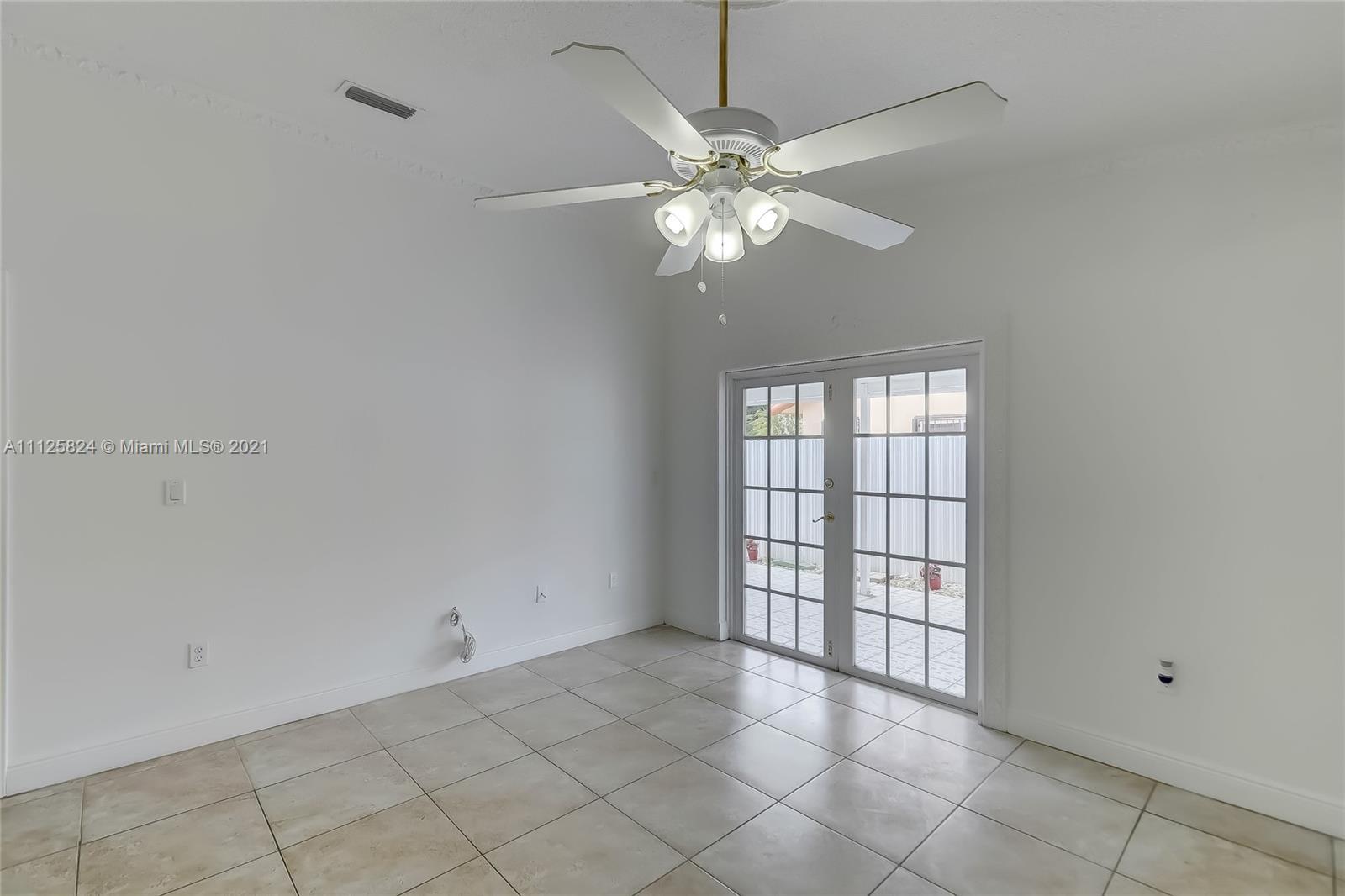 6858 West 30th Lane Hialeah, FL 33018 - Photo 20 of 37 a view of an empty room with a window