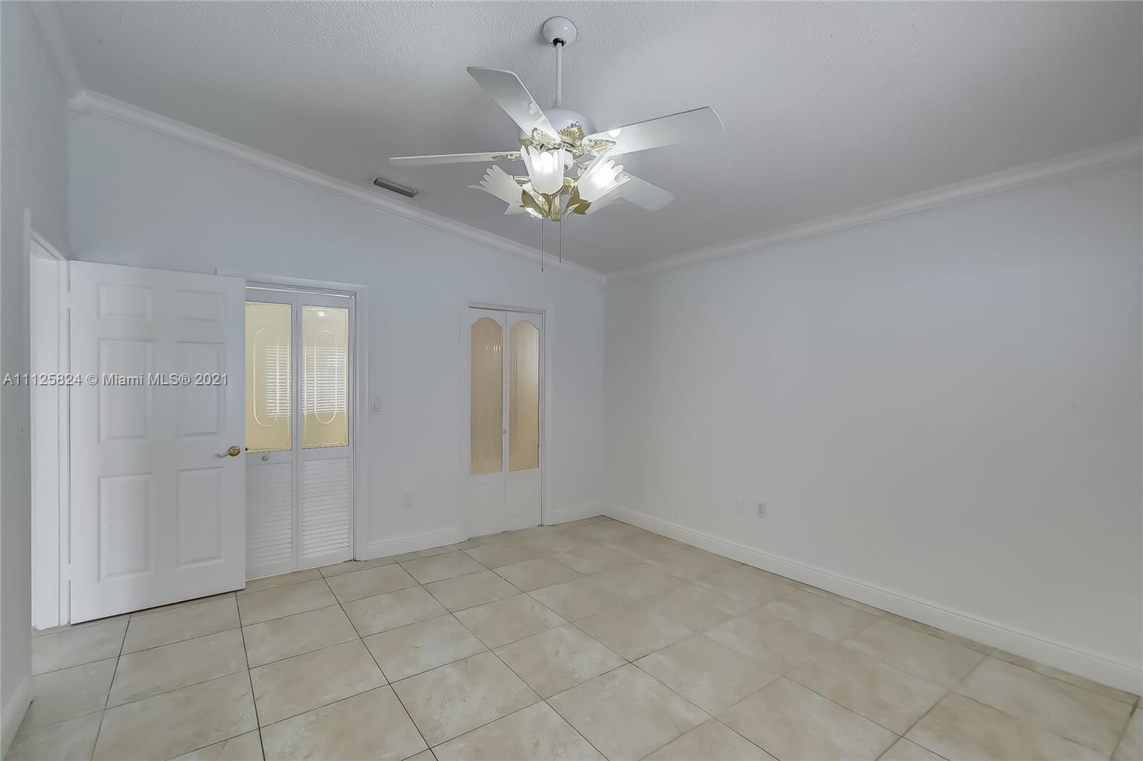 6858 West 30th Lane Hialeah, FL 33018 - Photo 25 of 37 a view of an empty room with a window