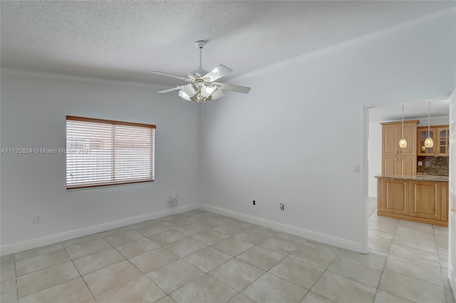 6858 West 30th Lane Hialeah, FL 33018 - Photo 27 of 37 a view of an empty room with a window