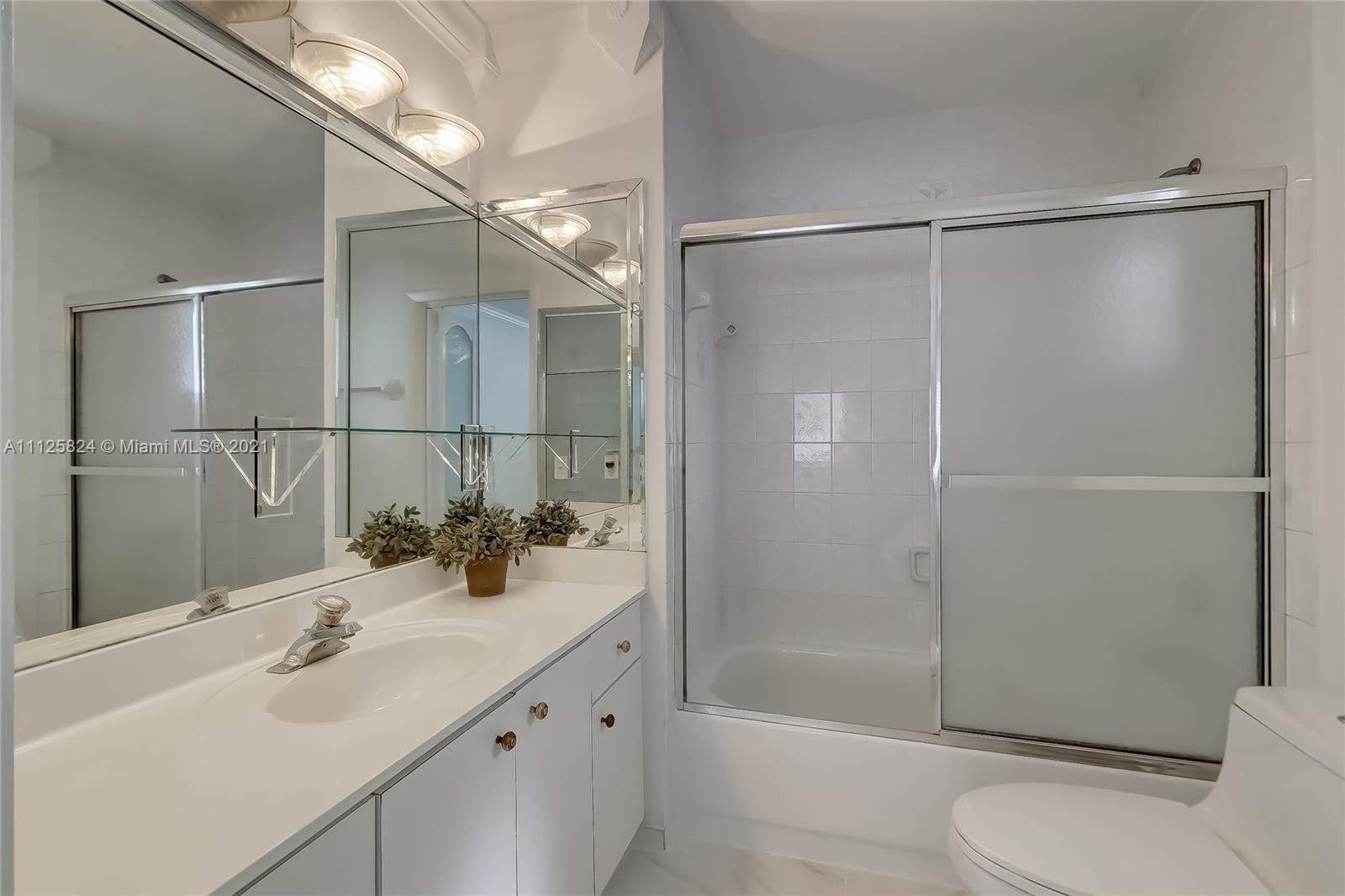 6858 West 30th Lane Hialeah, FL 33018 - Photo 28 of 37 a bathroom with a sink toilet and shower