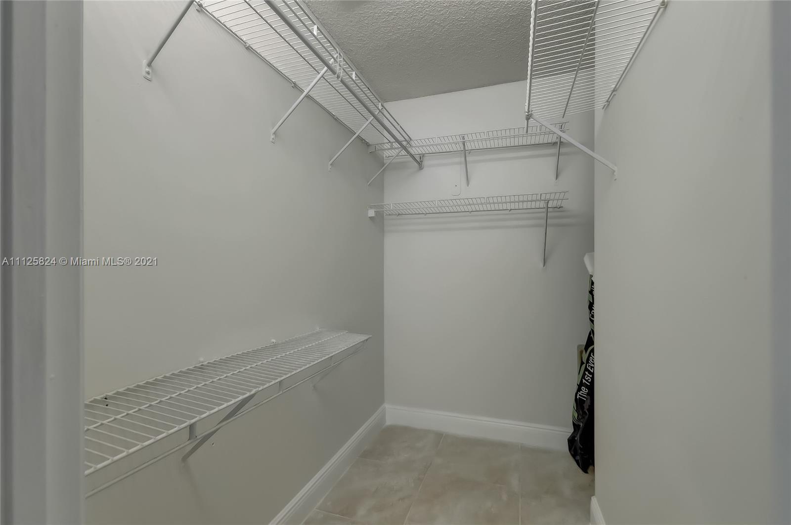 6858 West 30th Lane Hialeah, FL 33018 - Photo 30 of 37 a view of walk in closet