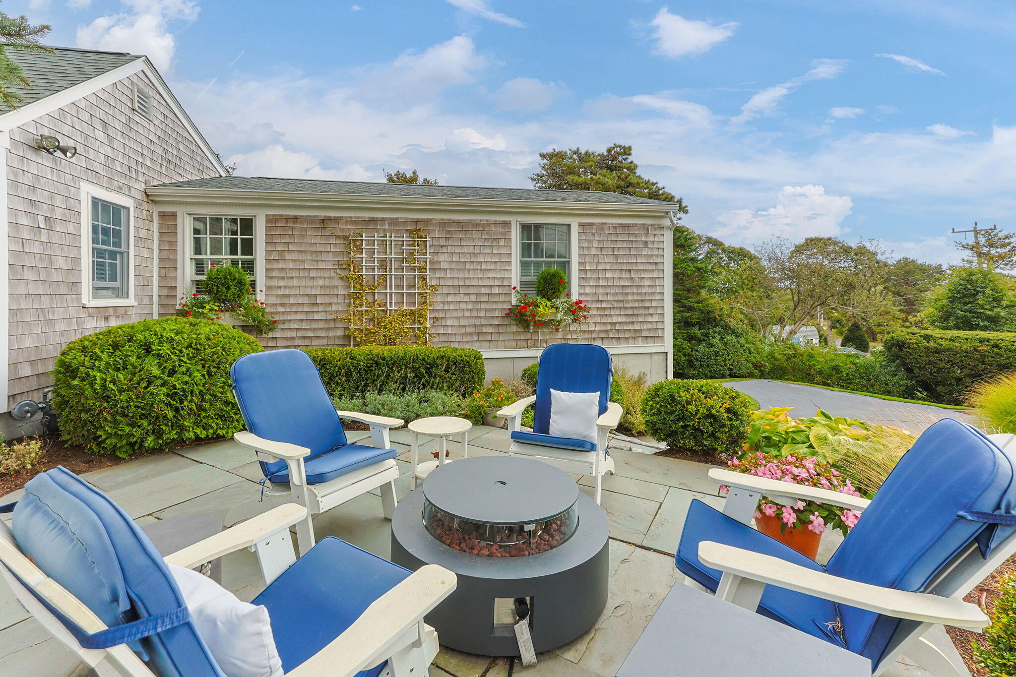 291 Ridgevale Road Chatham, MA 02633 - Photo 14 of 53 a view of a patio with couches chairs and a table
