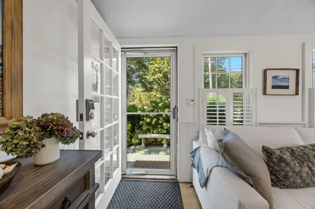 a living room with lots of furniture and a flat screen tv